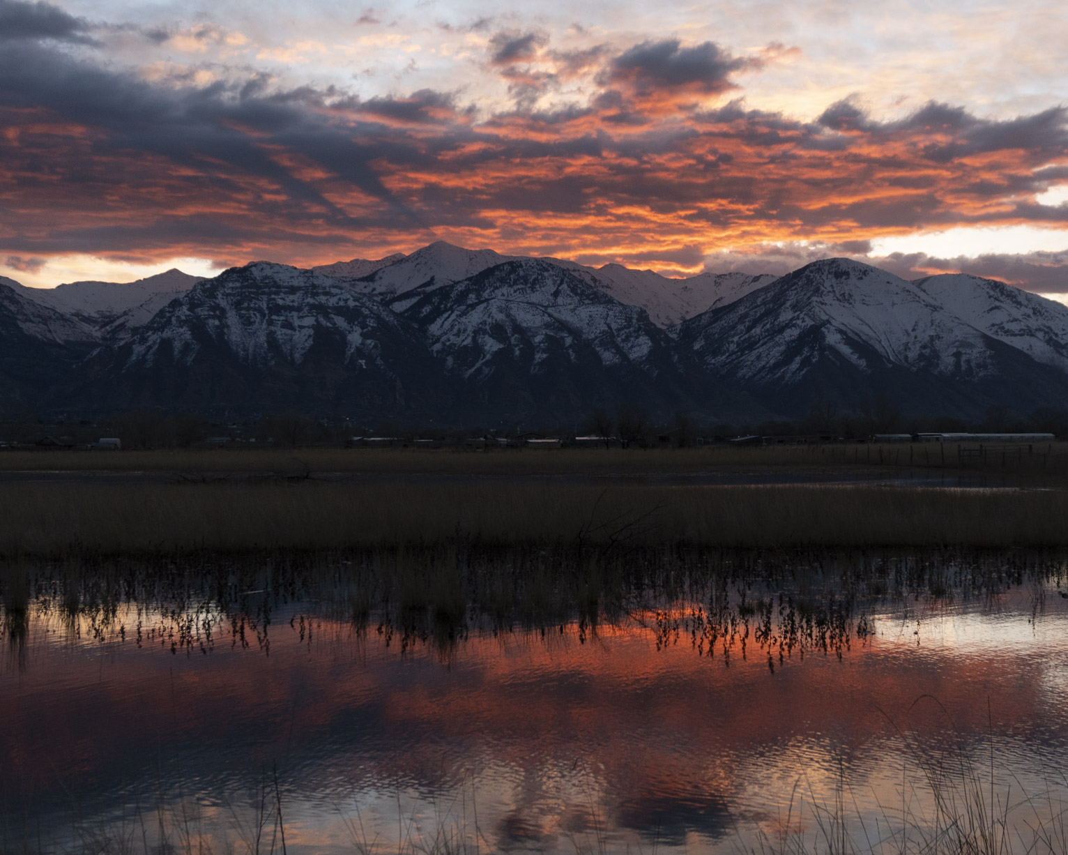 Majestic sunrise rays and glowing clouds over the mountains